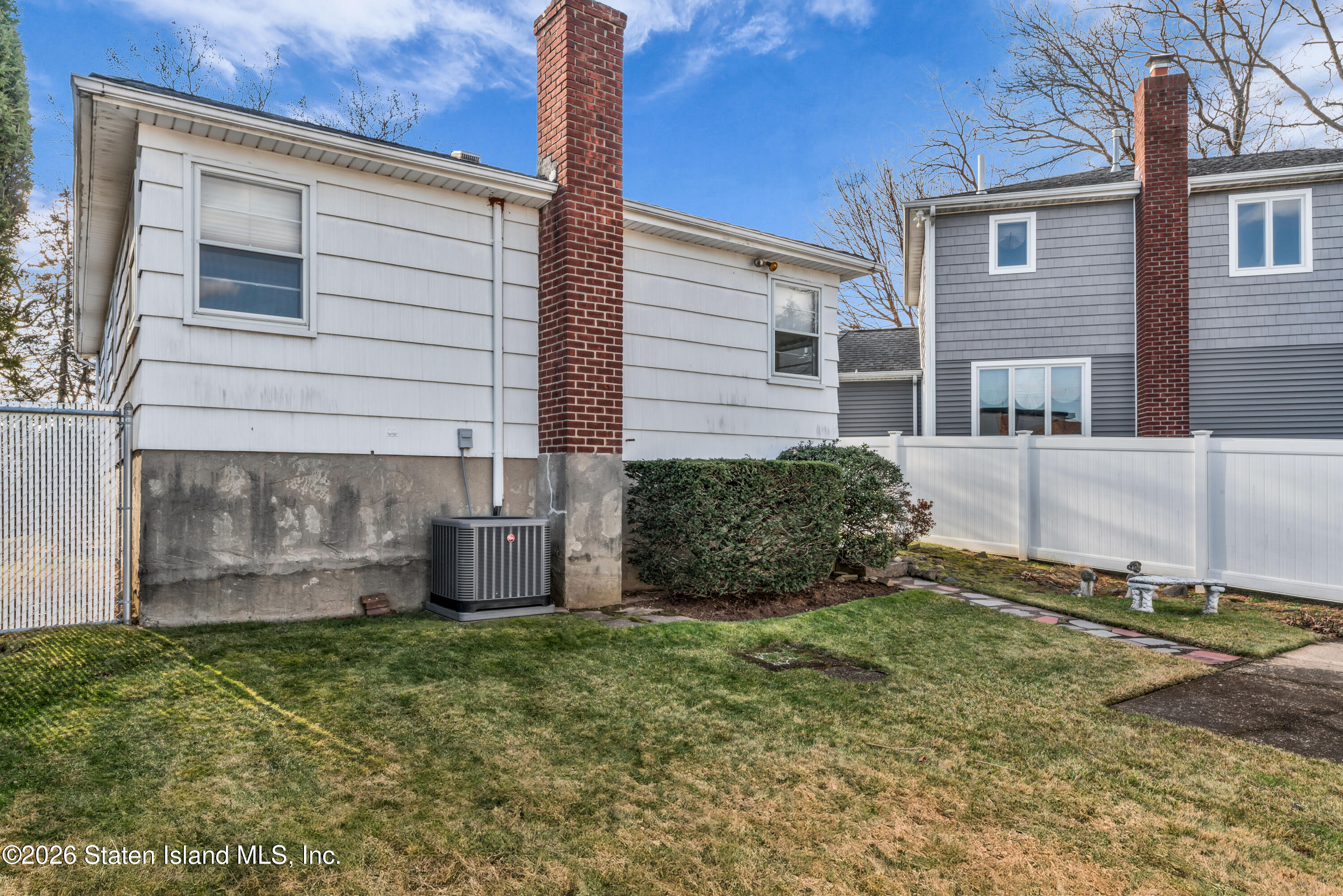 203 Wolverine Street Staten Island, NY 10306 - Photo 3 of 26 a view of a house with a yard