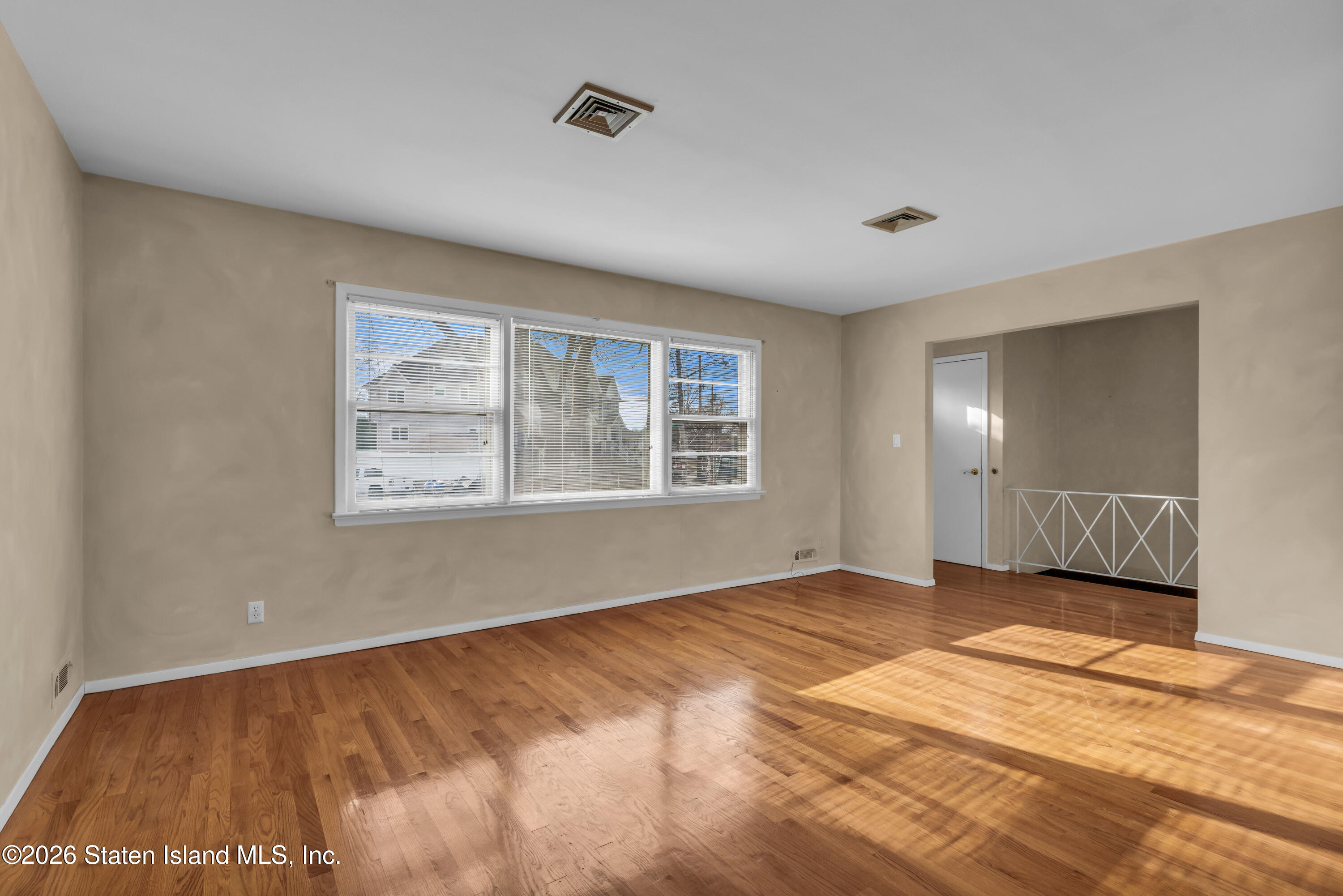 203 Wolverine Street Staten Island, NY 10306 - Photo 9 of 26 a view of an empty room with a window