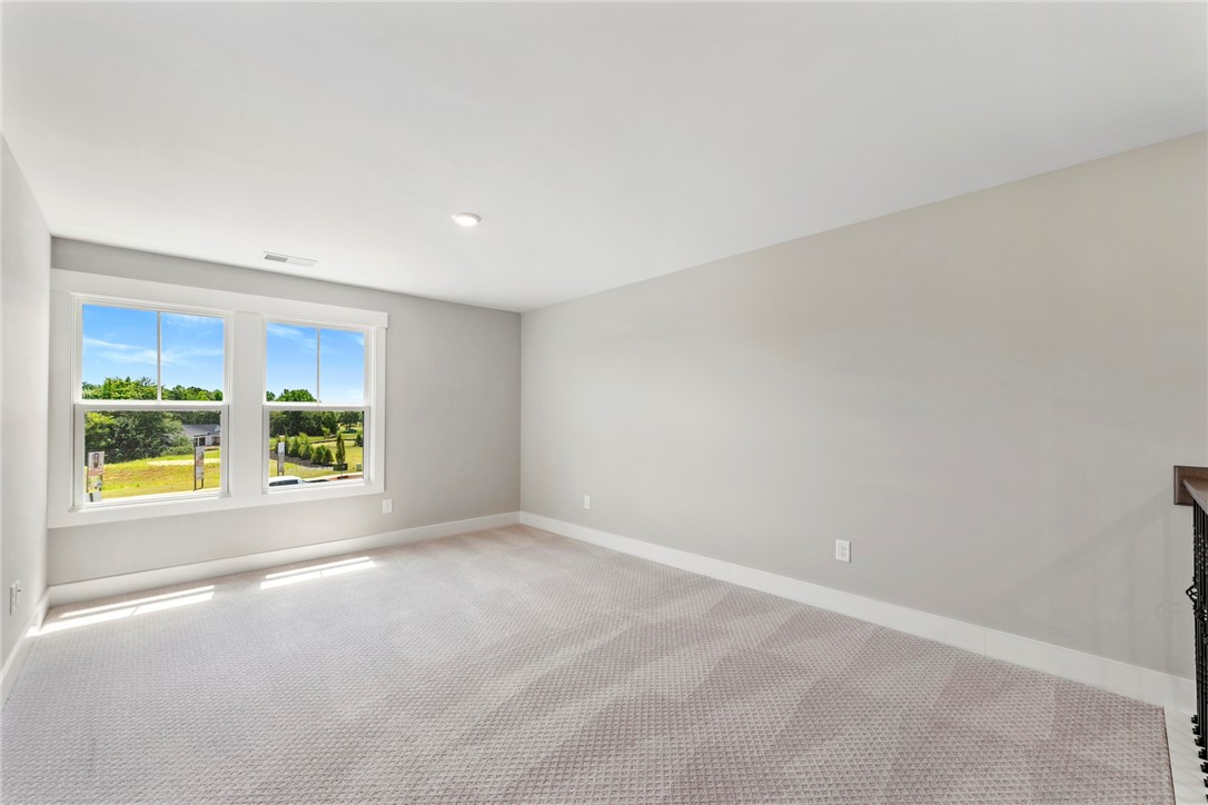 133 Osprey Landing Central, SC 29630 - Photo 17 of 34 This spacious room provides abundant natural light and overlooks a picturesque landscape.