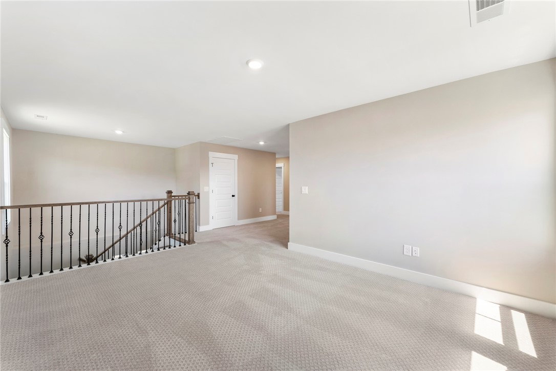 133 Osprey Landing Central, SC 29630 - Photo 18 of 34 This spacious loft offers ample room, bathed in natural light, perfect for flexible living.