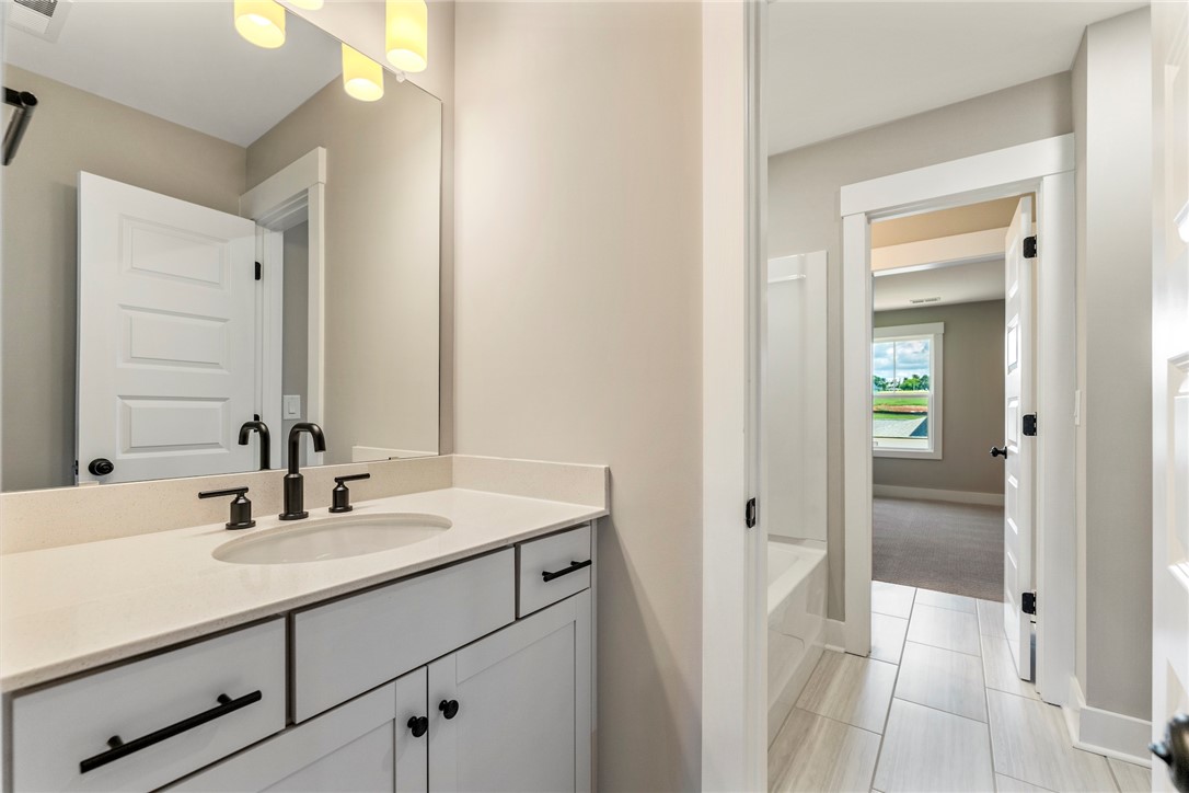 133 Osprey Landing Central, SC 29630 - Photo 29 of 34 This bathroom features a sleek vanity and modern fixtures, offering both style and functionality.