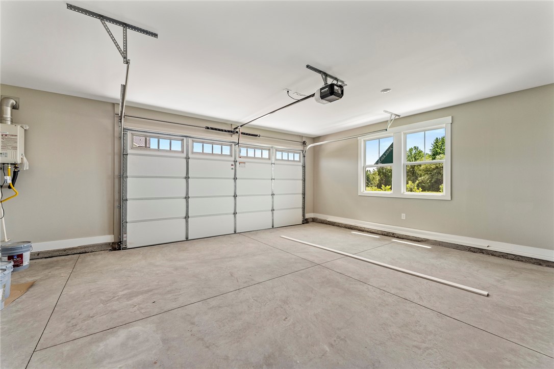133 Osprey Landing Central, SC 29630 - Photo 31 of 34 This spacious garage offers ample parking and additional storage, complemented by a large window for natural light.
