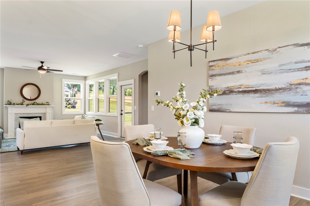 133 Osprey Landing Central, SC 29630 - Photo 4 of 34 This bright, inviting space seamlessly connects the dining area with a comfortable living room.