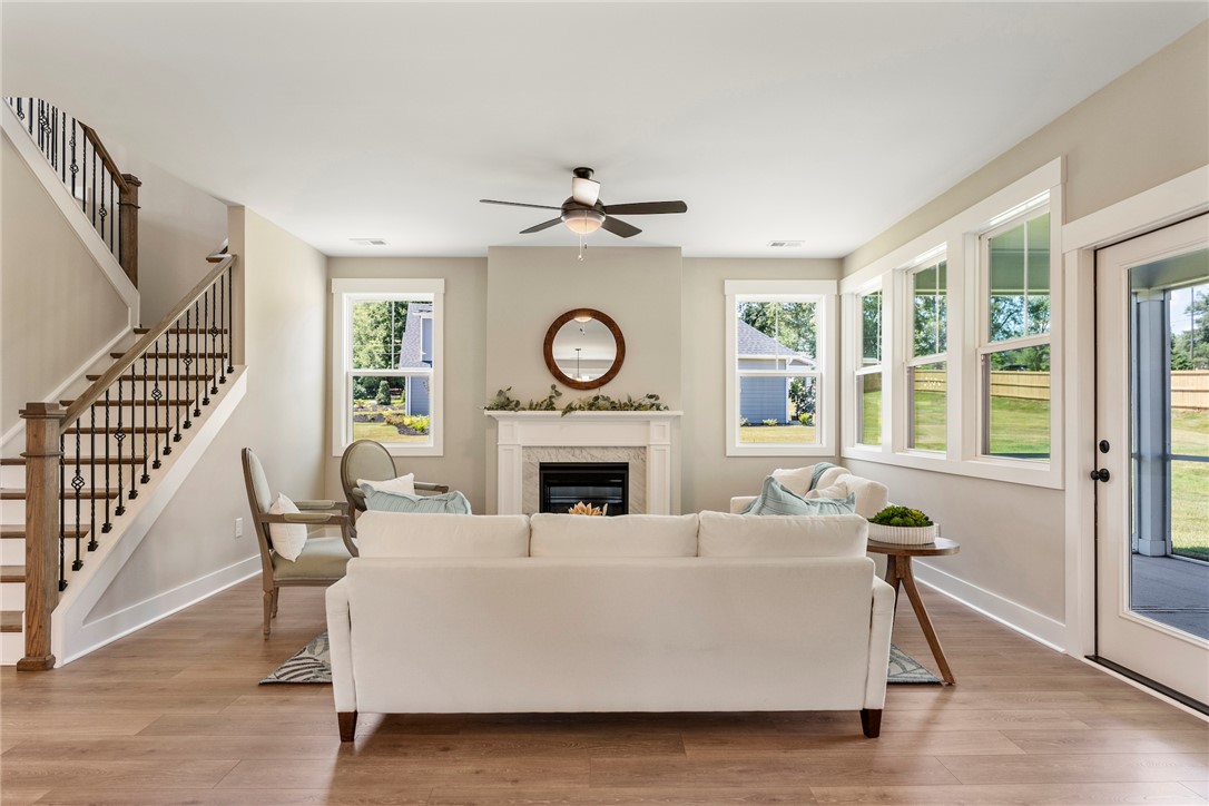 133 Osprey Landing Central, SC 29630 - Photo 7 of 34 This inviting living space features hardwood floors and abundant natural light.