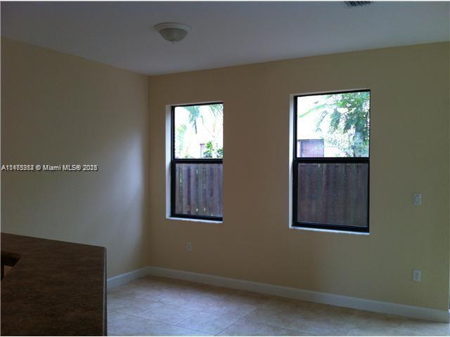 11459 Southwest 238th Street, Unit 11459 Homestead, FL 33032 - Photo 4 of 12 a view of an front door