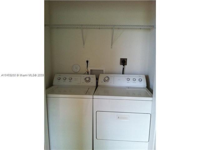 11459 Southwest 238th Street, Unit 11459 Homestead, FL 33032 - Photo 10 of 12 a utility room with dryer and washer