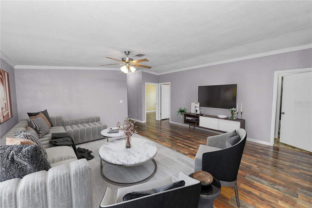 7405 Shoupe Road Plant City, FL 33565 - Photo 20 of 61 a living room with furniture and a flat screen tv