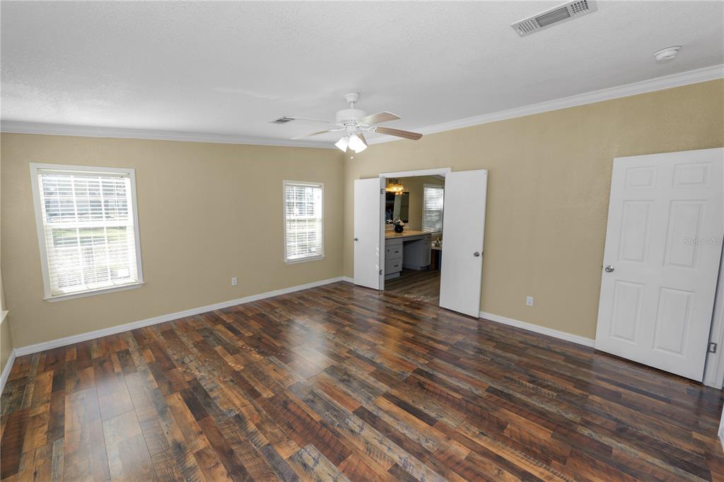 7405 Shoupe Road Plant City, FL 33565 - Photo 25 of 61 a view of an empty room with window and wooden floor
