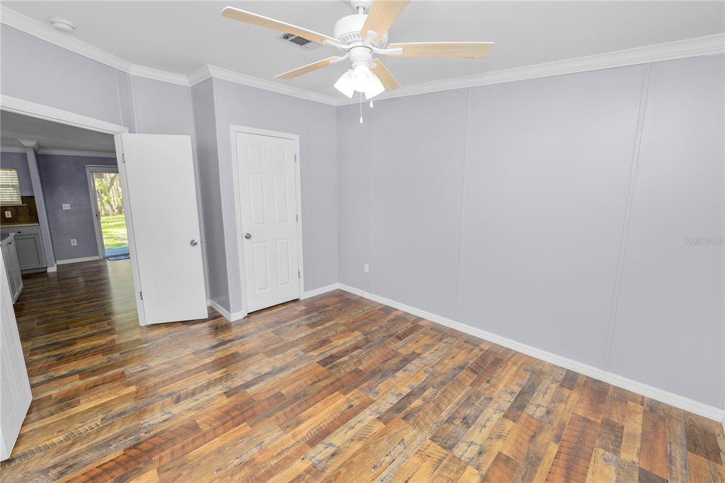 7405 Shoupe Road Plant City, FL 33565 - Photo 34 of 61 wooden floor in an empty room