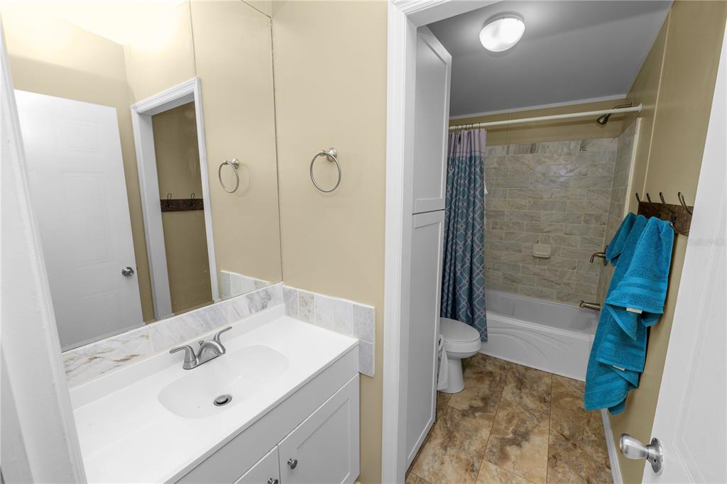 7405 Shoupe Road Plant City, FL 33565 - Photo 40 of 61 a bathroom with a sink a toilet and shower