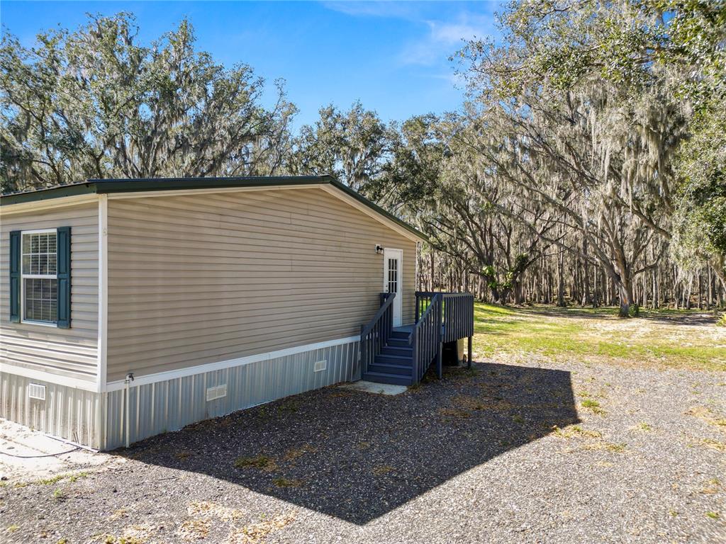 7405 Shoupe Road Plant City, FL 33565 - Photo 56 of 61 a view of a back yard of the house