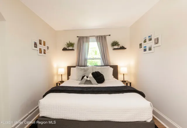 a bedroom with a bed and window