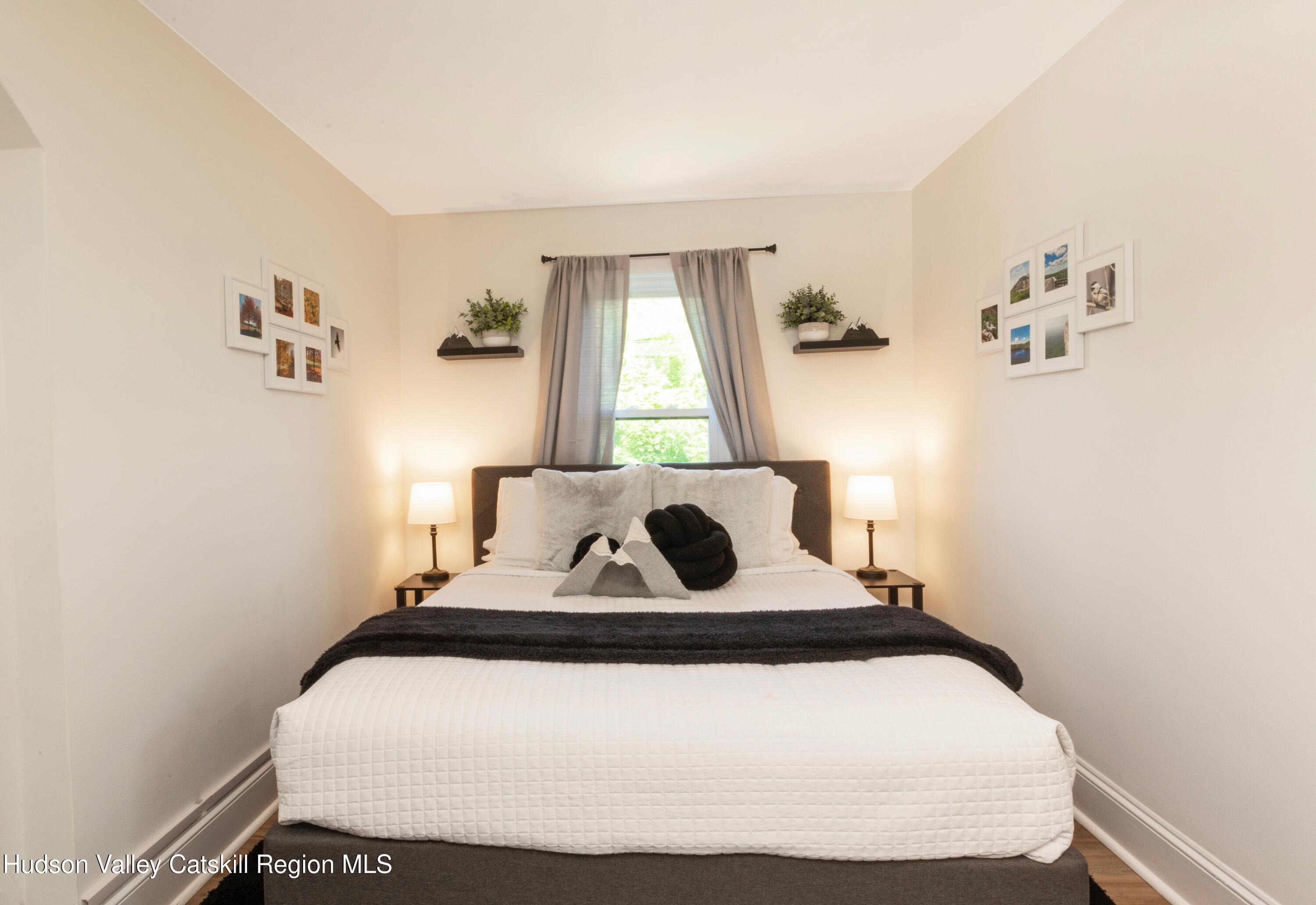 5813 Highway 44 Kerhonkson, NY 12446 - Photo 13 of 21 a bedroom with a bed and window