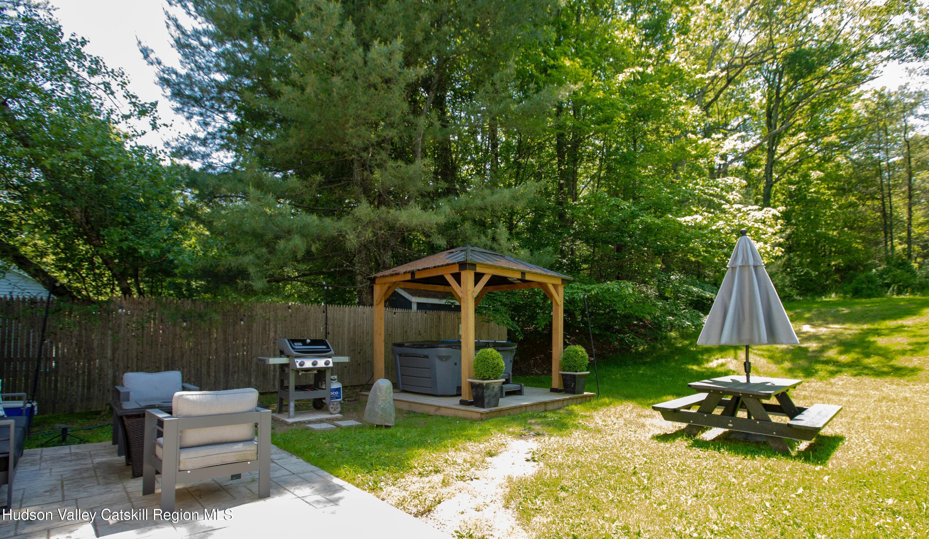 5813 Highway 44 Kerhonkson, NY 12446 - Photo 16 of 21 a view of a house with a yard patio and a slide