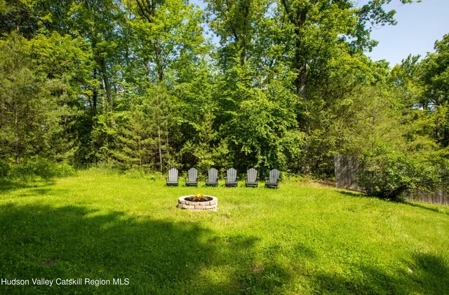 a view of a tree with a yard