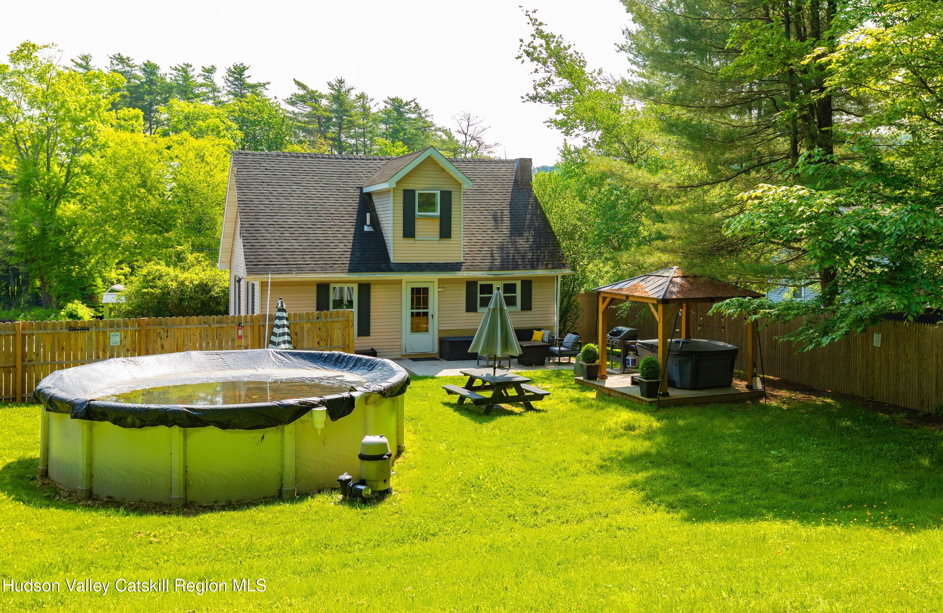 5813 Highway 44 Kerhonkson, NY 12446 - Photo 19 of 21 a view of a swimming pool with a patio