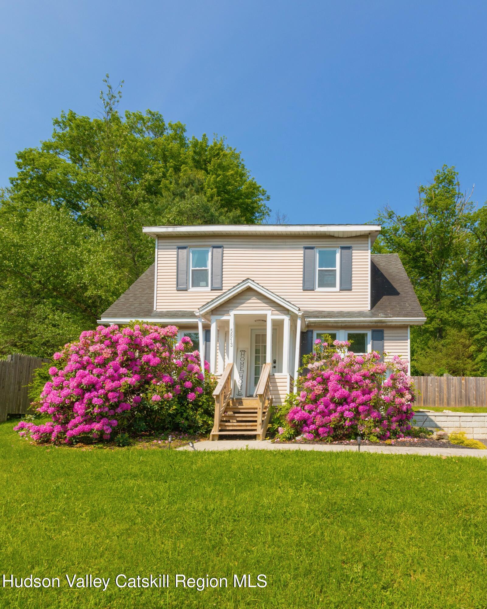 5813 Highway 44 Kerhonkson, NY 12446 - Photo 2 of 21 a front view of a house with a big yard