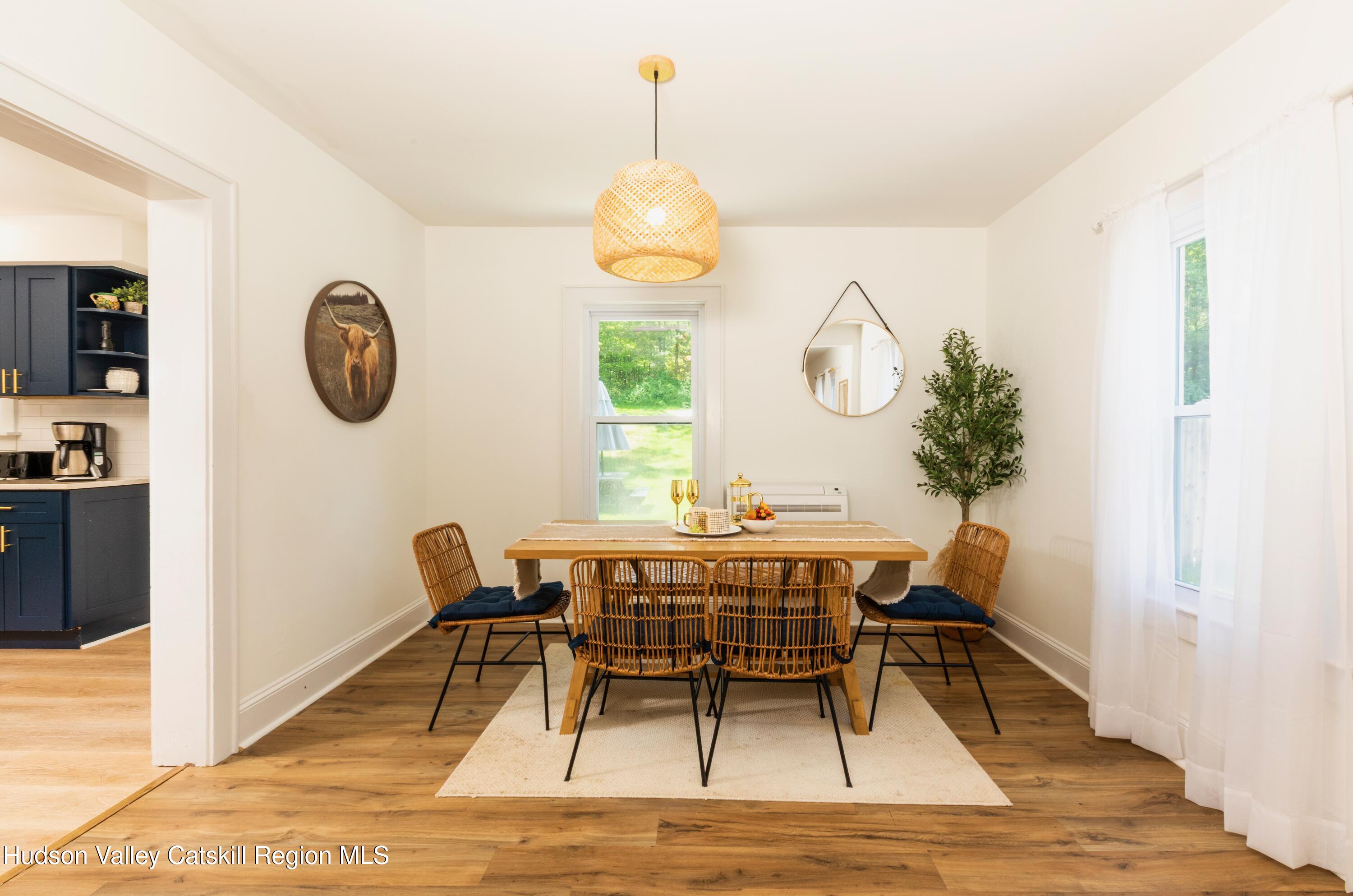 5813 Highway 44 Kerhonkson, NY 12446 - Photo 6 of 21 a view of a dining room with furniture window and wooden floor