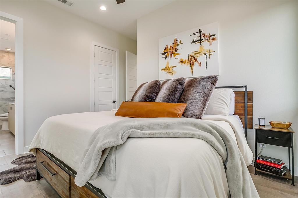 3231 Elihu Street, Unit 101 Dallas, TX 75210 - Photo 12 of 20 a bedroom with a bed and a couch
