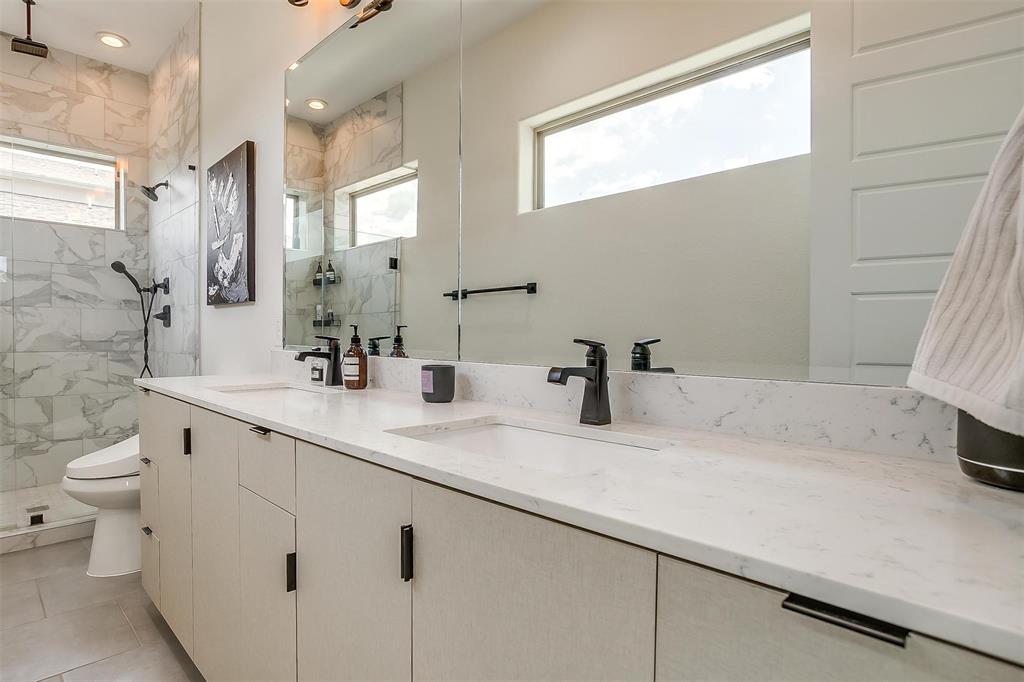 3231 Elihu Street, Unit 101 Dallas, TX 75210 - Photo 14 of 20 a bathroom with a sink and a toilet