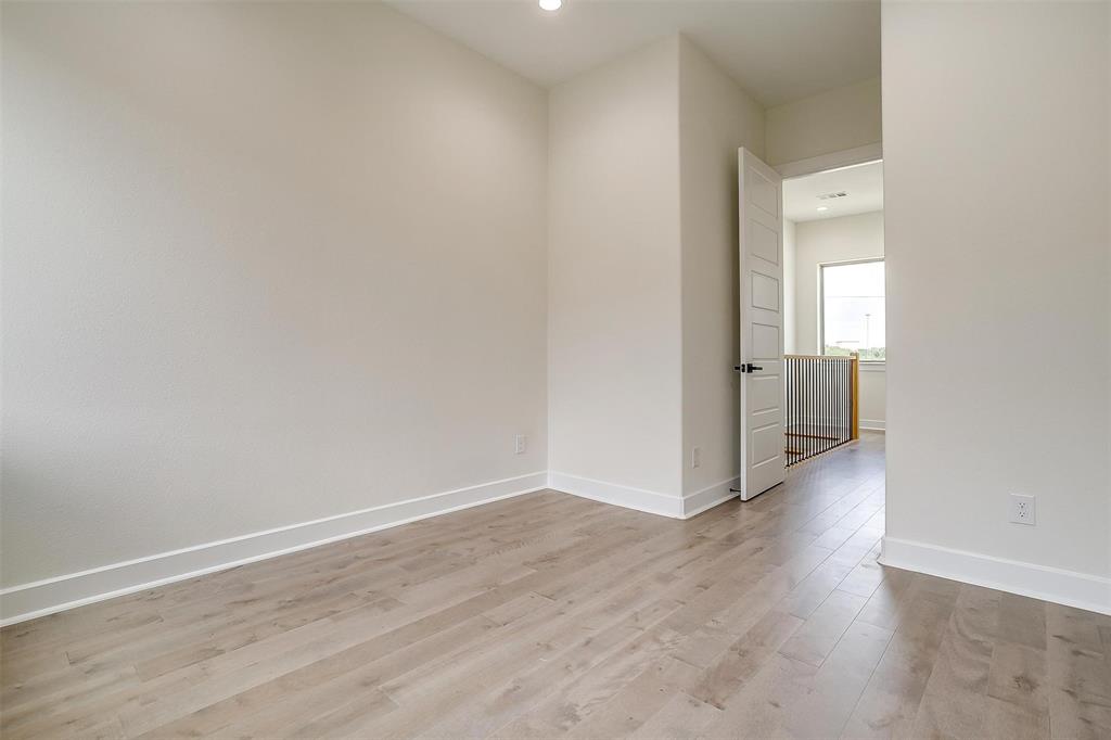 3231 Elihu Street, Unit 101 Dallas, TX 75210 - Photo 18 of 20 a view of a hallway with wooden floor