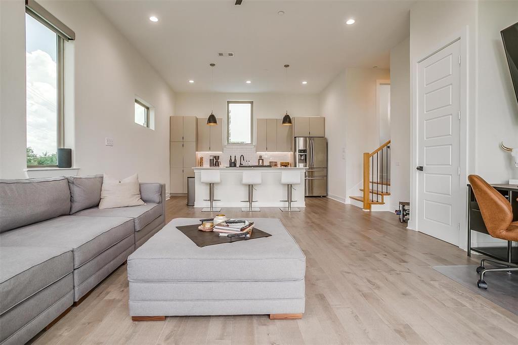 3231 Elihu Street, Unit 101 Dallas, TX 75210 - Photo 2 of 20 a living room with furniture and a large window