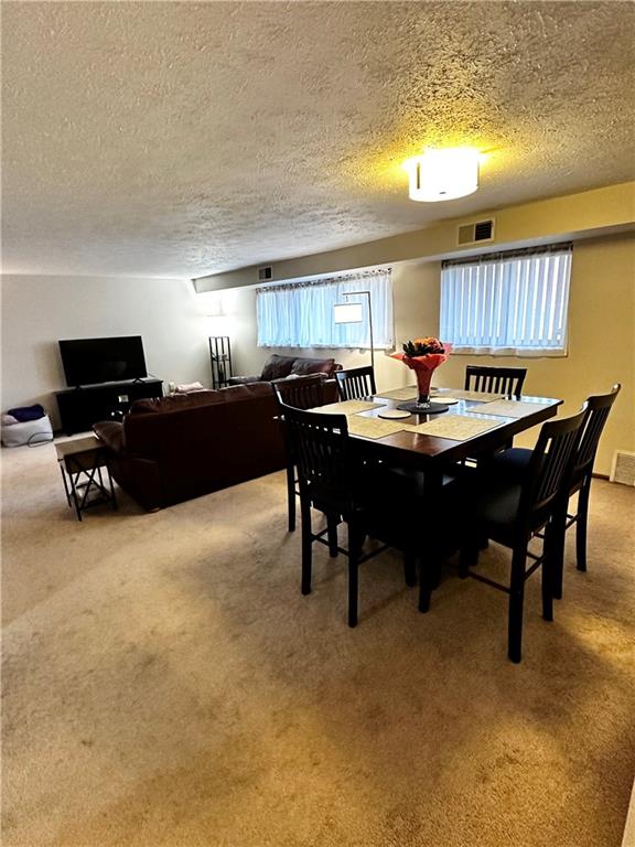 1205 Dutilh Road, Unit 1 Cranberry Township, PA 16066 - Photo 12 of 32 a dining room with a table and chairs