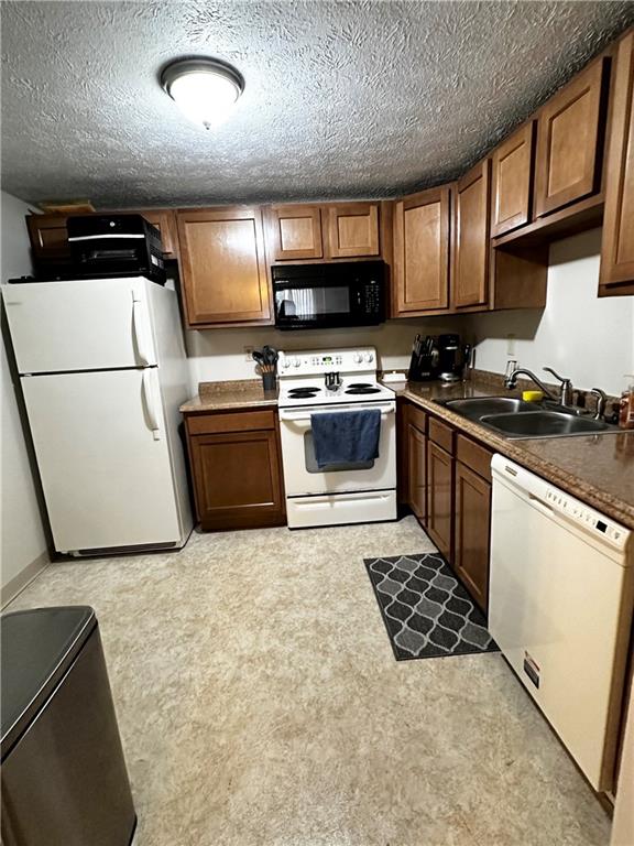 1205 Dutilh Road, Unit 1 Cranberry Township, PA 16066 - Photo 14 of 32 a kitchen with stainless steel appliances granite countertop a stove a sink and a refrigerator