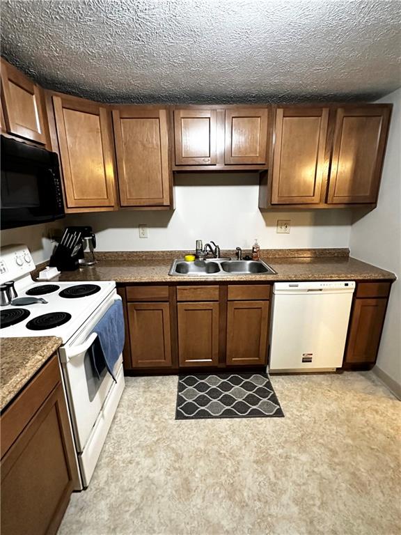1205 Dutilh Road, Unit 1 Cranberry Township, PA 16066 - Photo 15 of 32 a kitchen with a sink stove and microwave