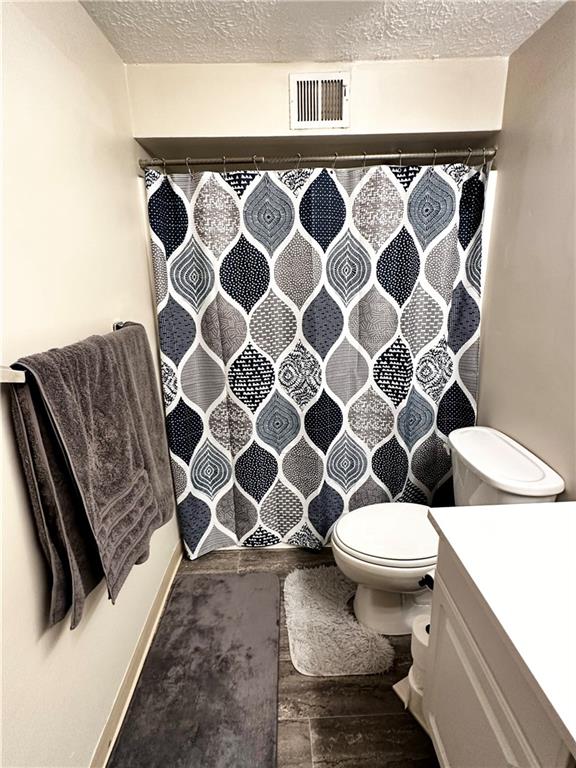 1205 Dutilh Road, Unit 1 Cranberry Township, PA 16066 - Photo 18 of 32 a bathroom with a sink a toilet and a shower
