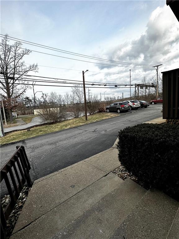 1205 Dutilh Road, Unit 1 Cranberry Township, PA 16066 - Photo 4 of 32 a view of a city street with car parked