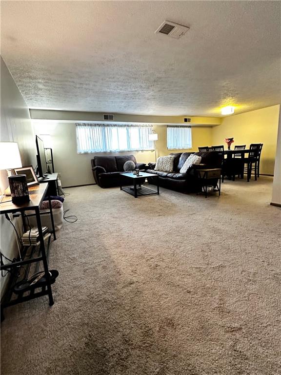 1205 Dutilh Road, Unit 1 Cranberry Township, PA 16066 - Photo 7 of 32 a living room with furniture and a flat screen tv