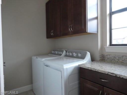9685 Montelanico Loop, Unit 202 Naples, FL 34119 - Photo 20 of 21 a utility room with dryer and washer