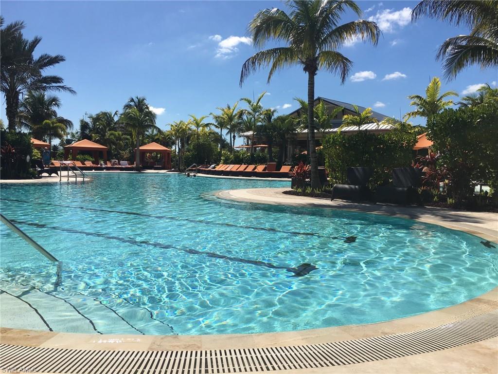 9685 Montelanico Loop, Unit 202 Naples, FL 34119 - Photo 2 of 21 a view of swimming pool having outdoor seating