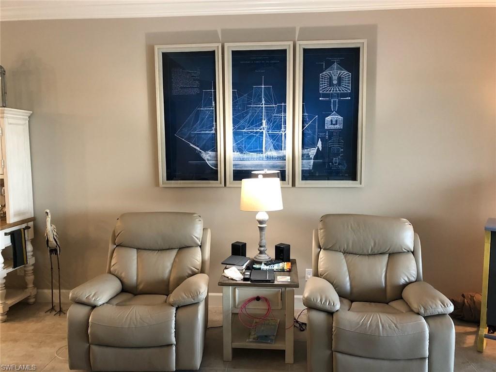 9685 Montelanico Loop, Unit 202 Naples, FL 34119 - Photo 9 of 21 a living room with furniture and a window