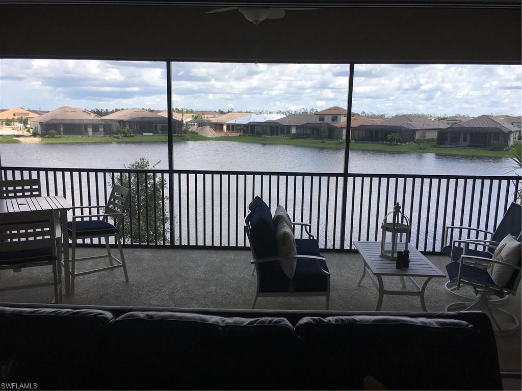 9685 Montelanico Loop, Unit 202 Naples, FL 34119 - Photo 10 of 21 a balcony with wooden floor