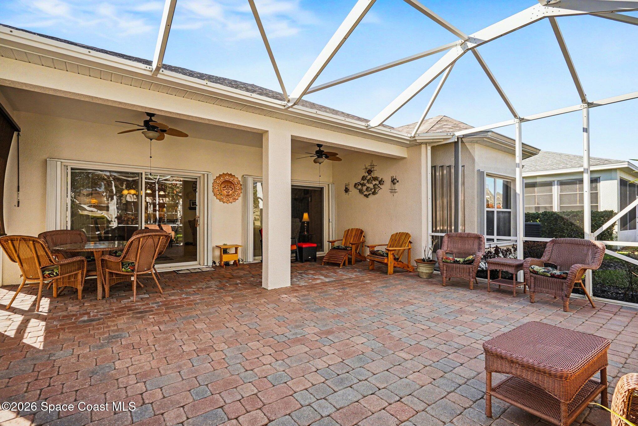 6973 Premonition Drive Melbourne, FL 32940 - Photo 24 of 91 a view of a livingroom with furniture and floor to ceiling window
