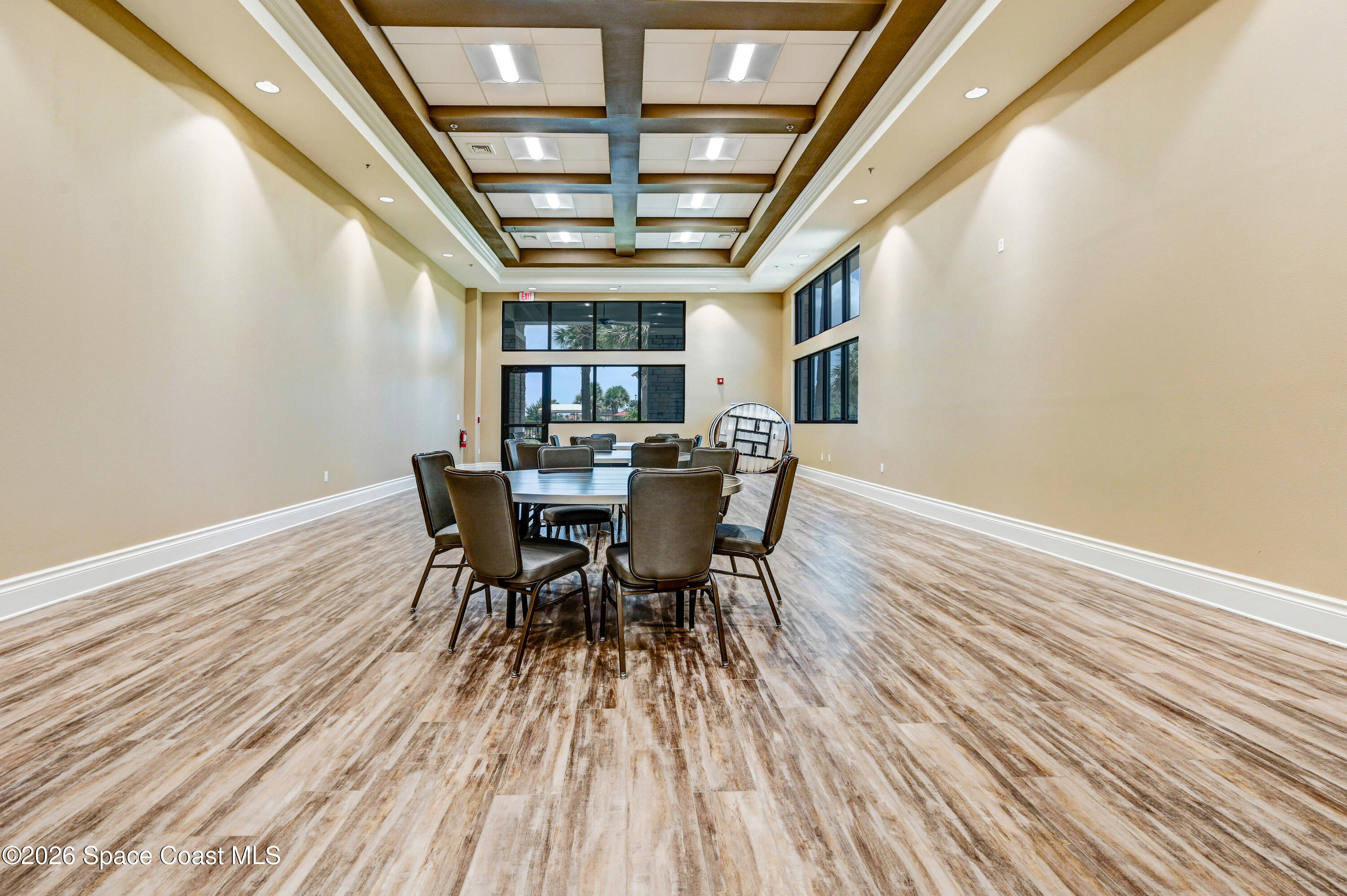 6973 Premonition Drive Melbourne, FL 32940 - Photo 31 of 91 a view of a dining room with furniture and wooden floor