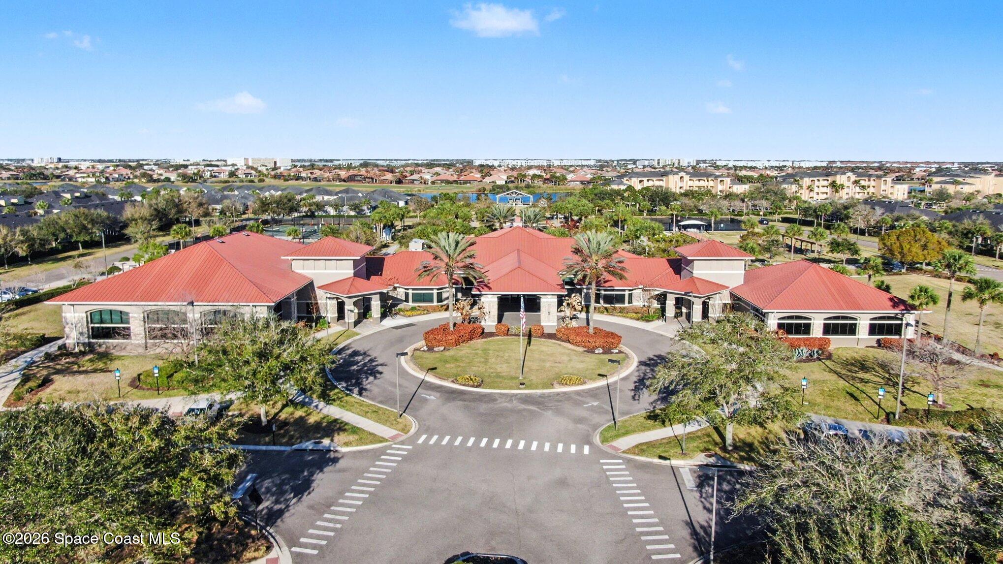 6973 Premonition Drive Melbourne, FL 32940 - Photo 73 of 91 an aerial view of a swimming pool and mountain view in back