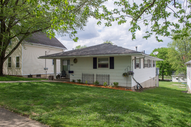 504 East Cleveland Street Spring Valley, IL 61362 - Photo 1 of 18 a view of a house with a yard and sitting area