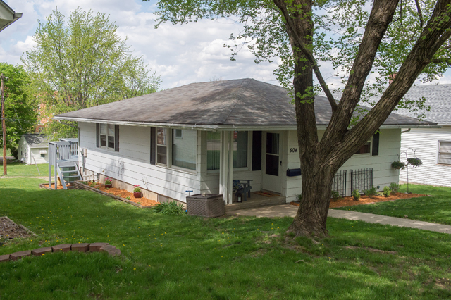 504 East Cleveland Street Spring Valley, IL 61362 - Photo 18 of 18 a front view of house with a garden and trees