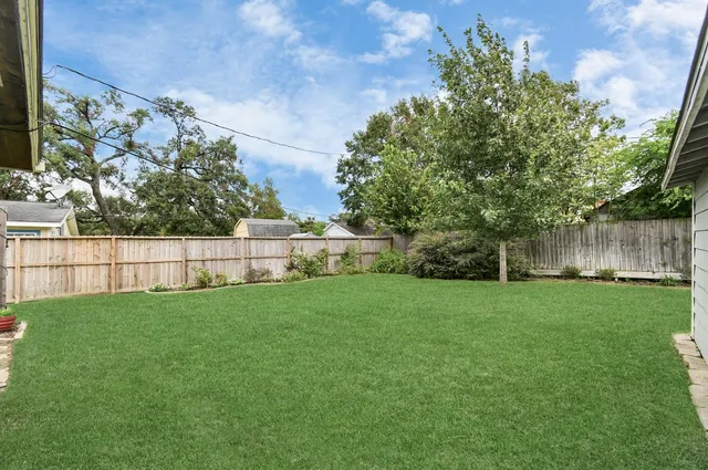 a view of backyard with green space