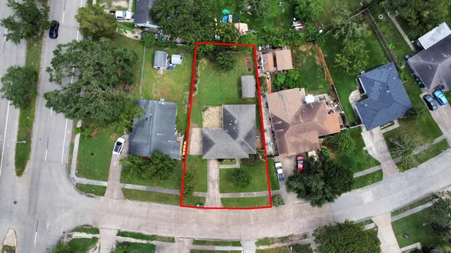 an aerial view of a house with a garden and plants