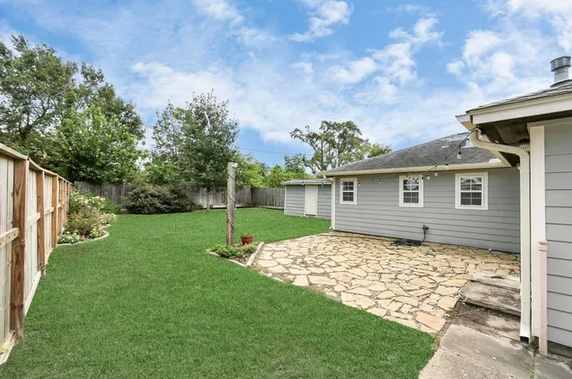 a backyard of a house with lots of green space