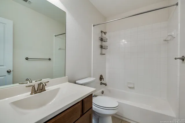 a view of an empty room with a chandelier