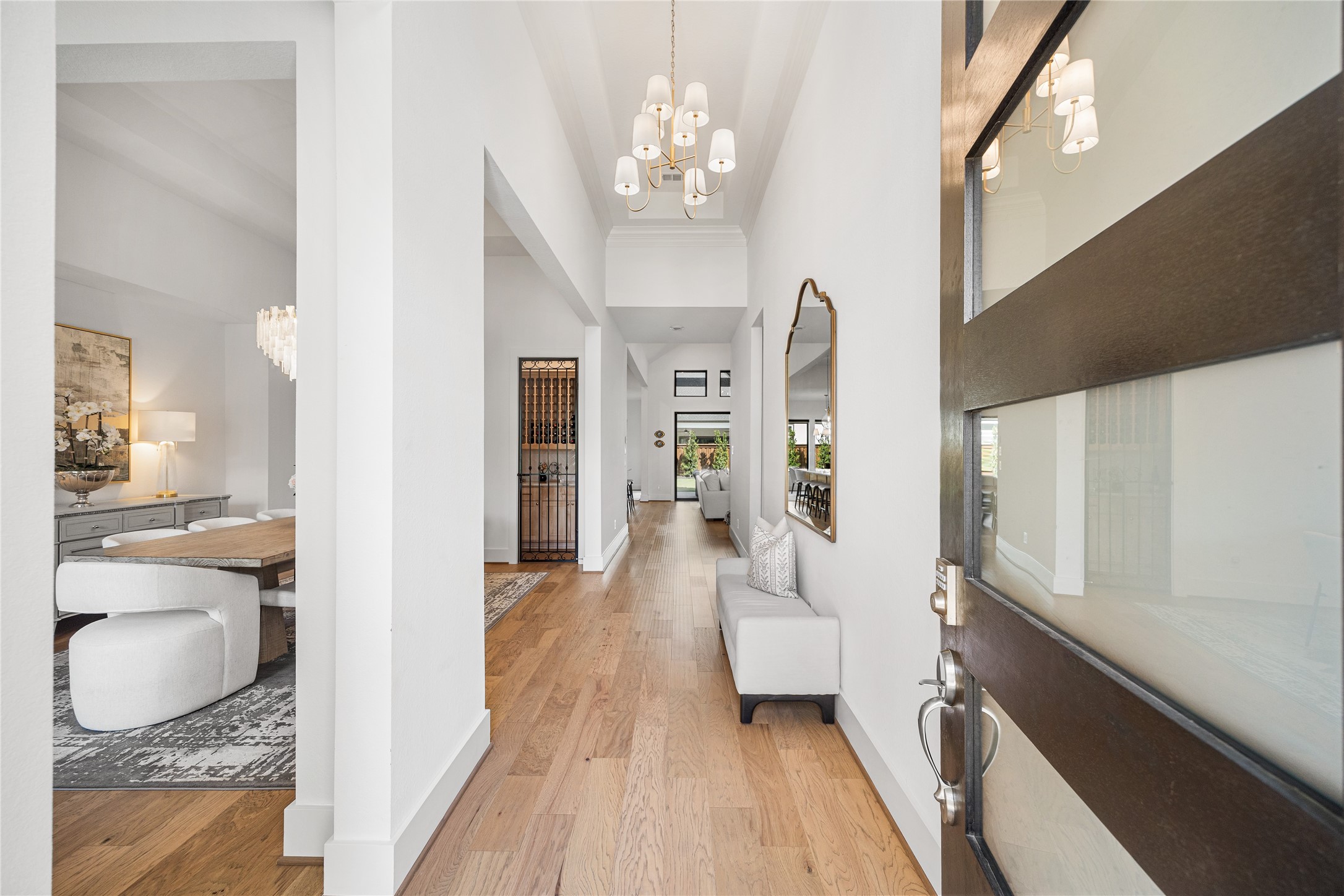 4229 Hollow Wind Way Spring, TX 77386 - Photo 2 of 49 Grand foyer with gallery-style hallway and sightlines beyond.