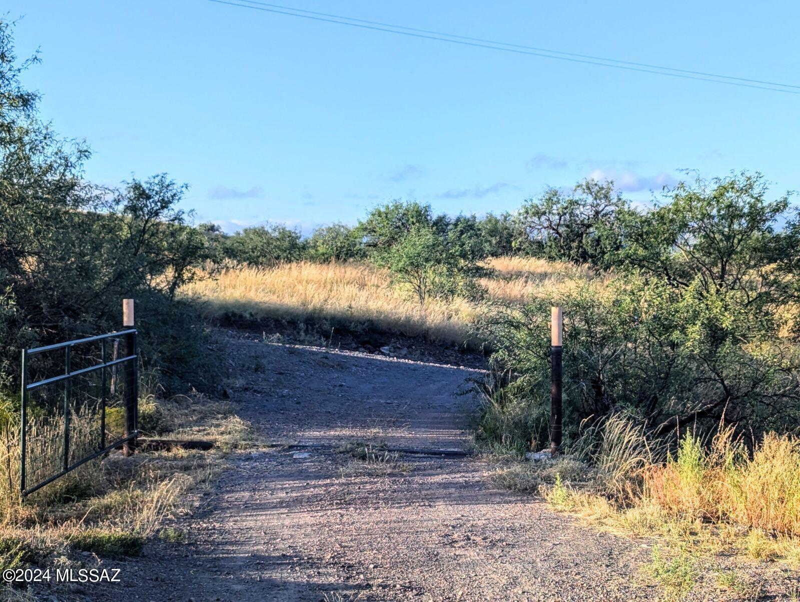 35700 South Cedar Creek Road Arivaca, AZ 85601 - Photo 23 of 44 a view of a lake from a yard