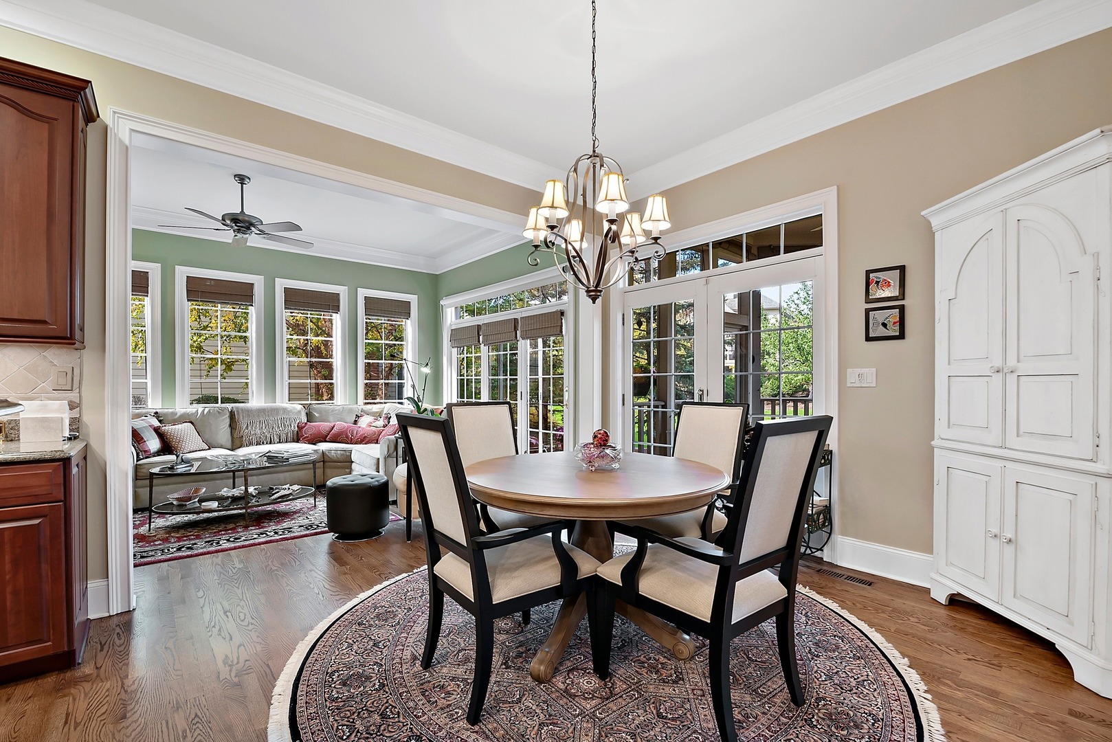 1036 Ridgeview Drive Inverness, IL 60010 - Photo 14 of 35 a view of a dining room with furniture wooden floor and chandelier