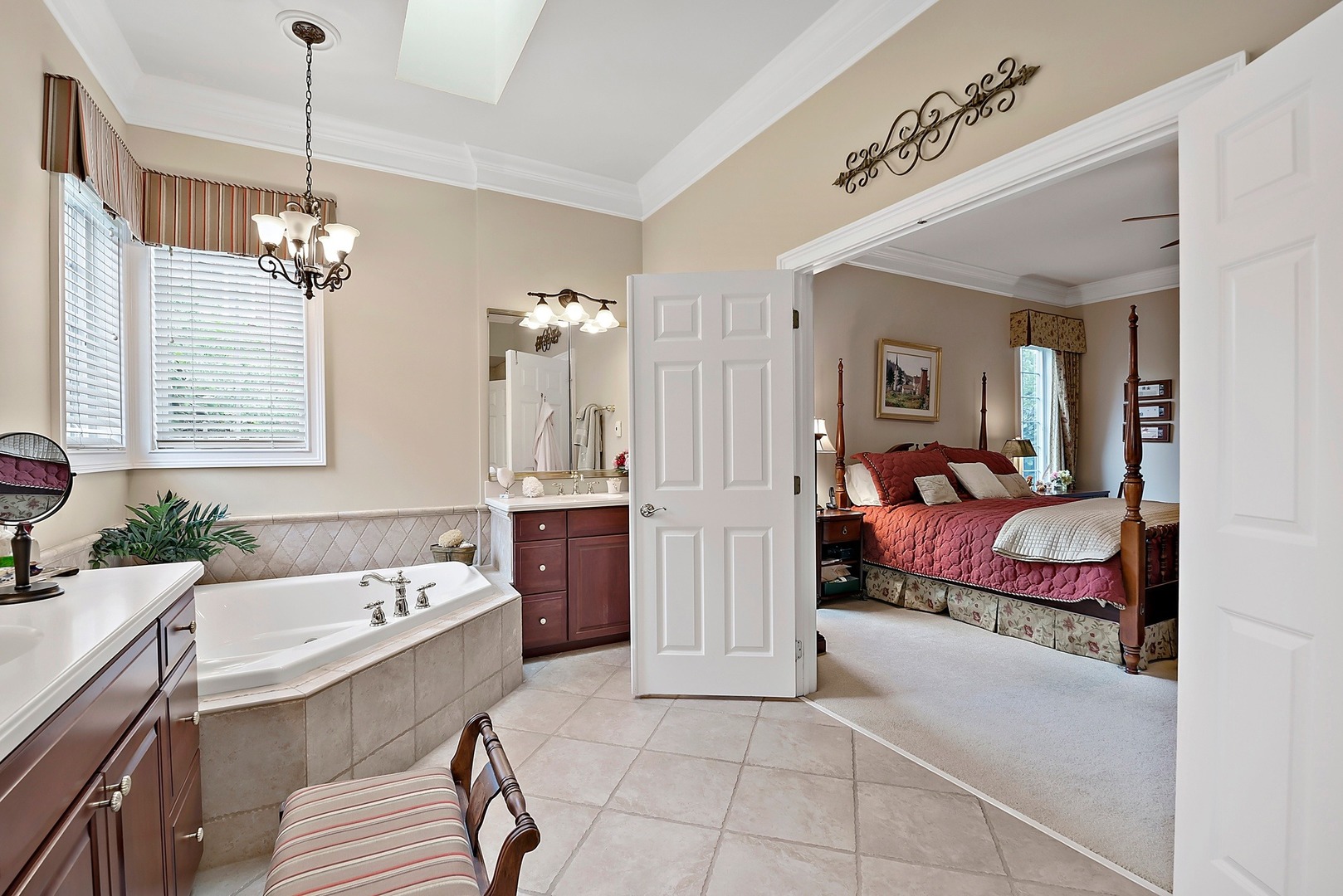 1036 Ridgeview Drive Inverness, IL 60010 - Photo 17 of 35 a spacious bedroom with a bed and a chandelier