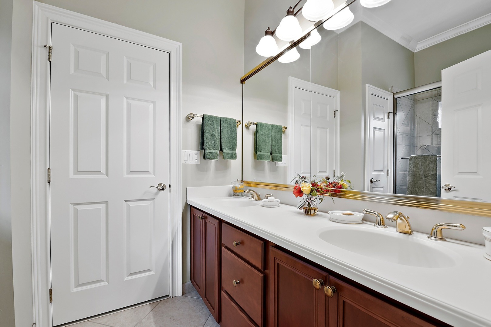 1036 Ridgeview Drive Inverness, IL 60010 - Photo 19 of 35 a bathroom with a double vanity sink and a mirror